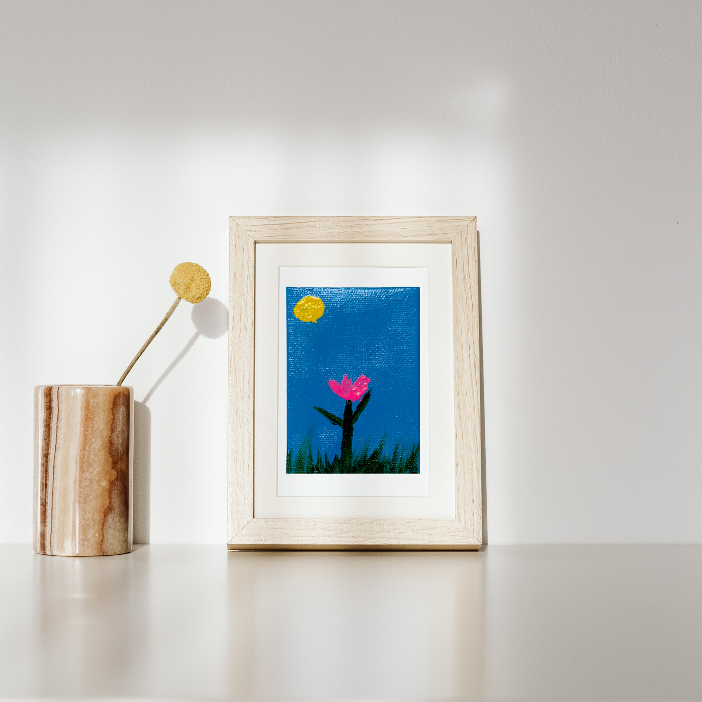 A serene pink flower canvas under a golden sun and twilight sky.